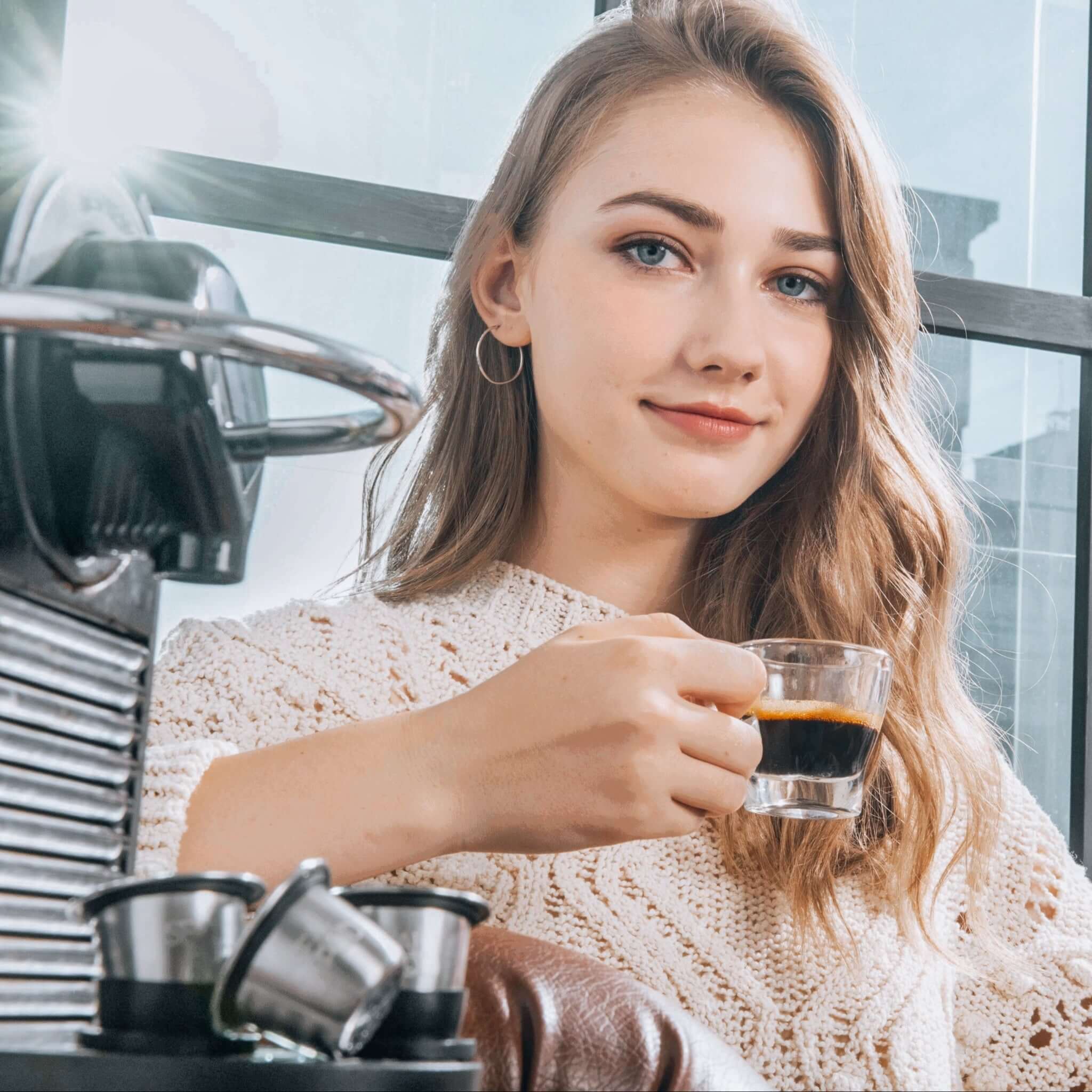 Girl Enjoying Coffee brewd using Sealpod's Nespresso reusable pod 